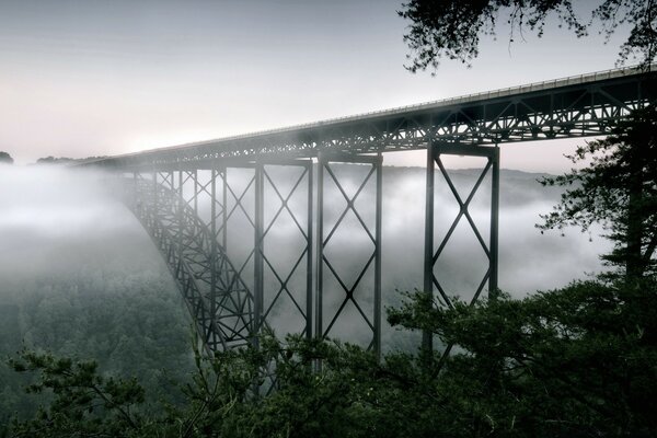 A bridge going into a thick fog