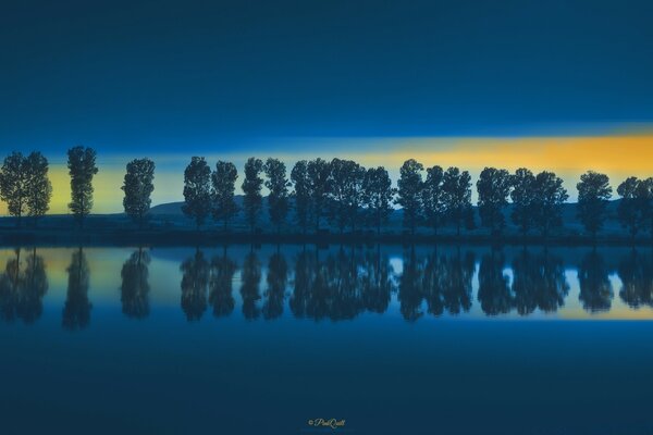 Moon reflection in the wild above the lake