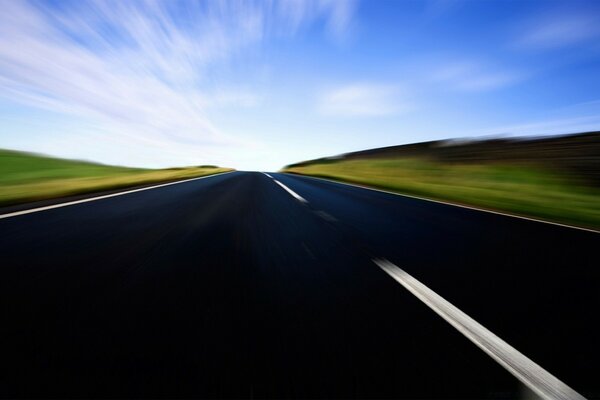 Highway at speed in the blue sky