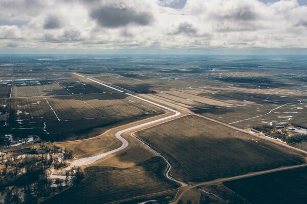 View of the earth with roads and fields from the plane