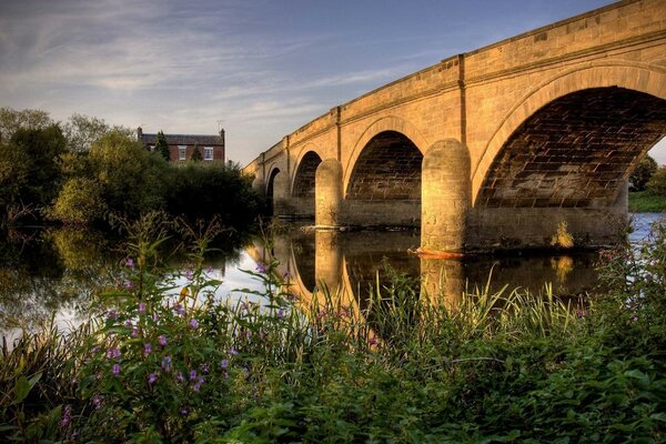 View of the stone bridge over a small river