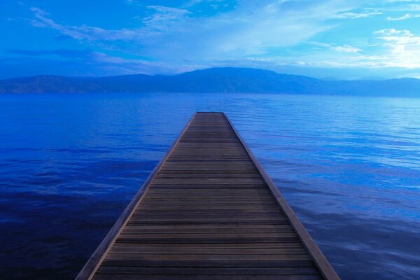 A bridge extending far into the lake