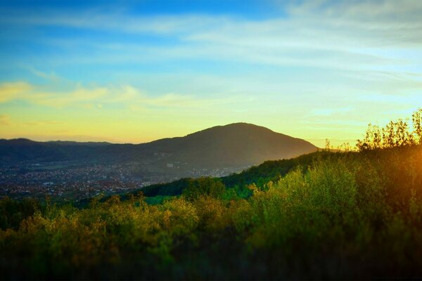 Sunset among mountains and forests