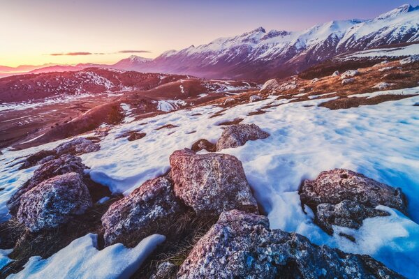 Rocky snow-covered road in the mountains