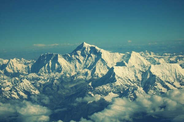 Snowy mountains. A view of the mountains from a height