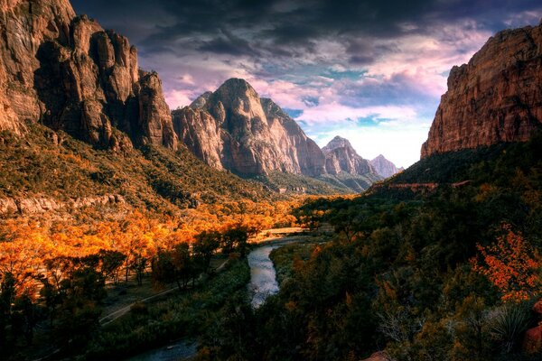 Autumn river flowing between canyons