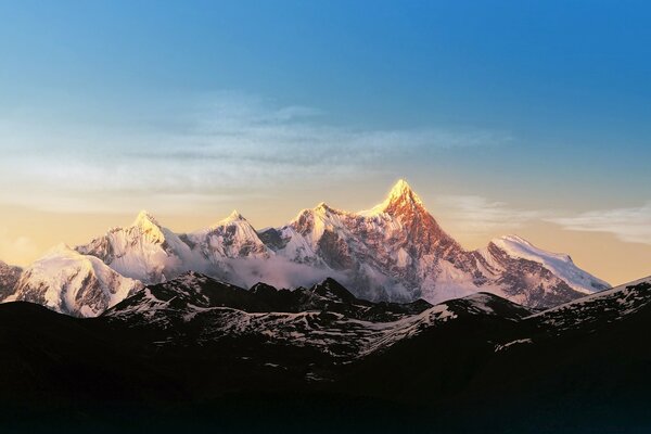 High mountains stand in the snow