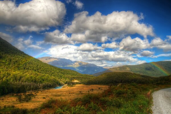 Rainbow in the clouds in the high mountains