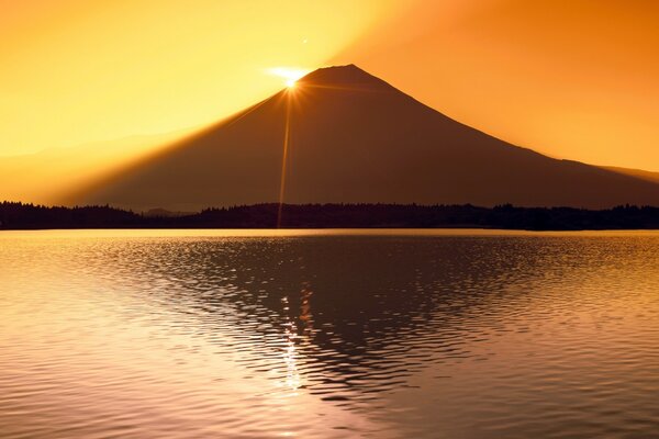 Dawn in the mountains. The beam breaks through the water column