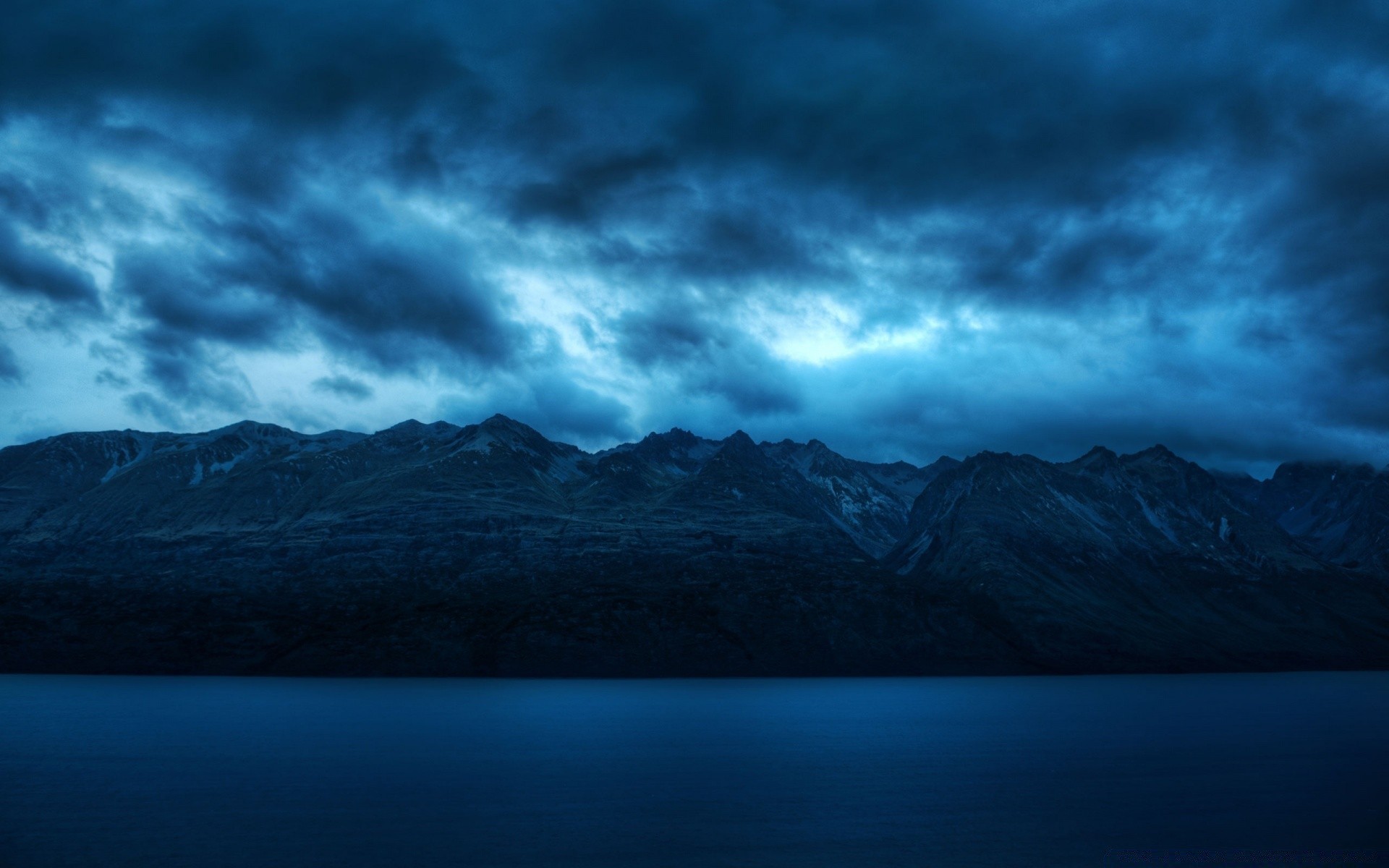 mountains landscape sky sunset mountain nature storm snow evening water dawn outdoors light travel fog lake daylight weather dark dusk