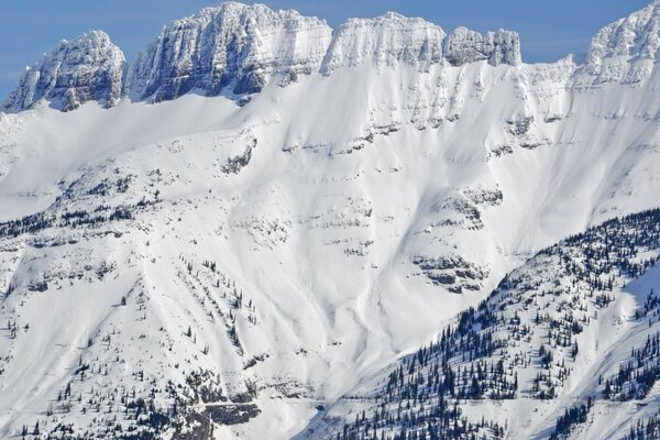 Cold snow-capped mountain peaks