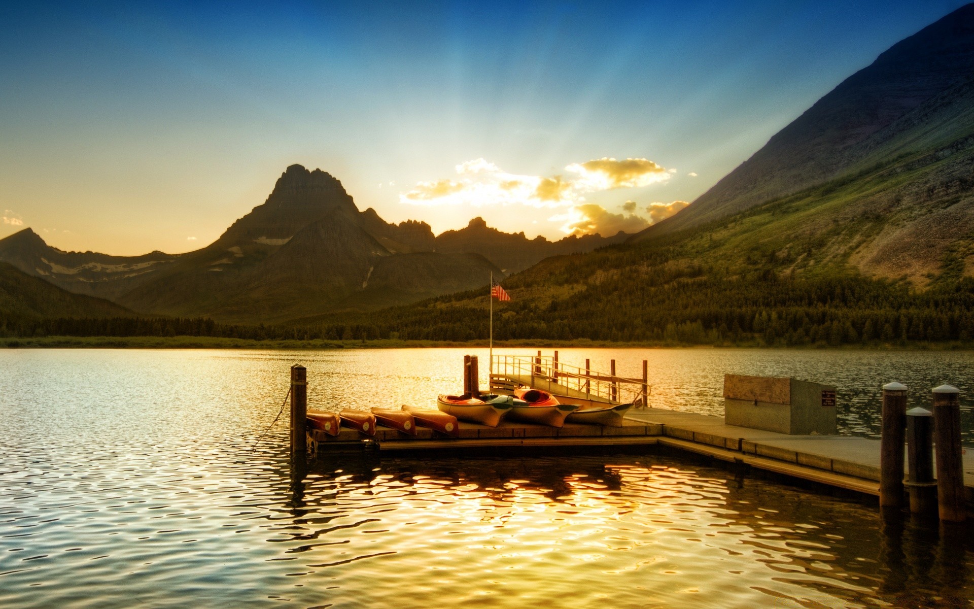 lake water travel sunset watercraft boat dawn transportation system river reflection outdoors mountain vehicle landscape sky sea evening nature recreation