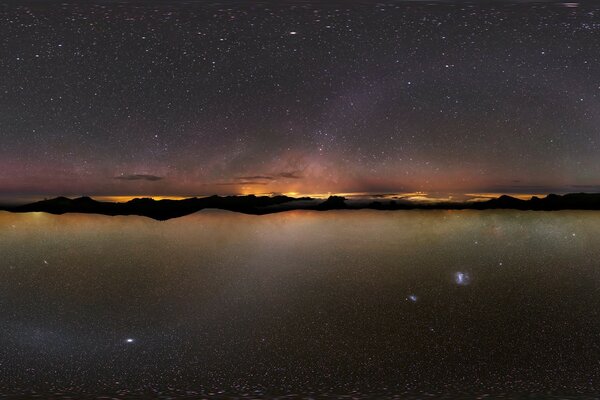 Night starry sky over the lake