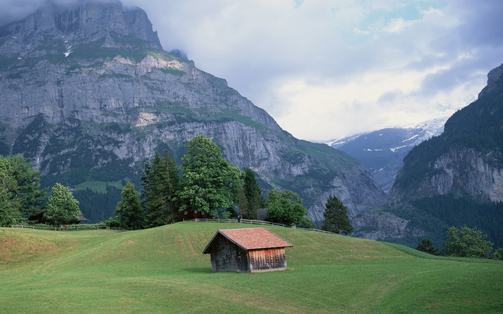 mountains mountain landscape travel valley scenic nature outdoors wood tree hill grass sky hayfield summer mountain peak daylight hut