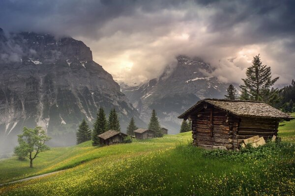 Wooden huts at the foot of the mountains