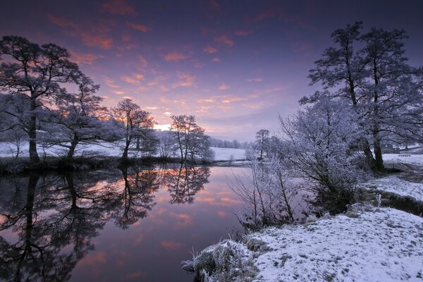 Winter time on the river with sunset