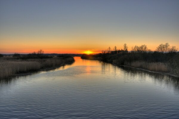 Evening beautiful sunset by the river