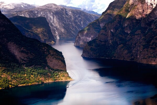 A dark deep river between the mountains