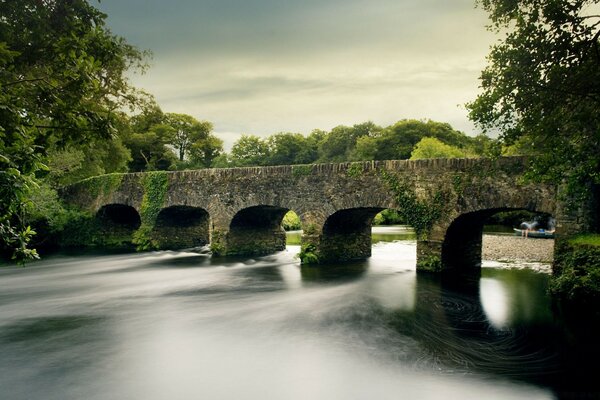 Old ancient bridge over the river