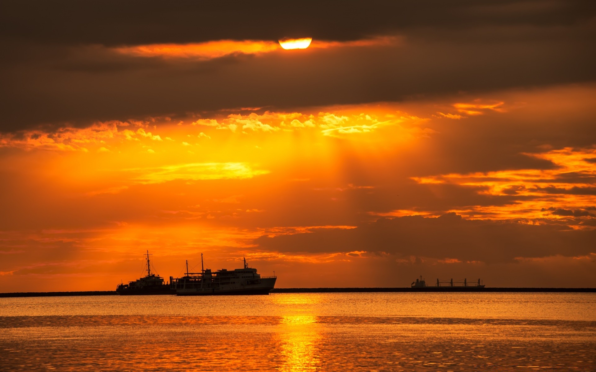 the sky sunset dawn water sun dusk evening sea ocean sky backlit