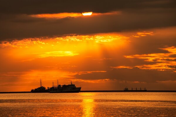 Sunset on the sea above the ships