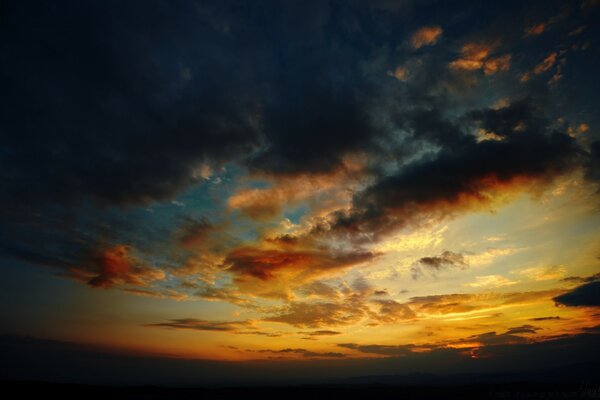 Echoes of the sun through the clouds at sunset