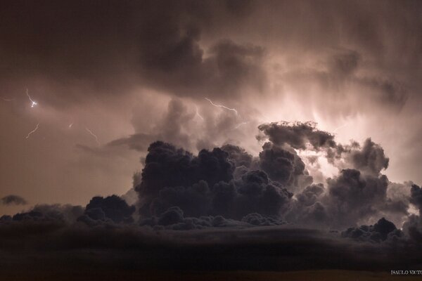 A terrible storm at sunset over the city