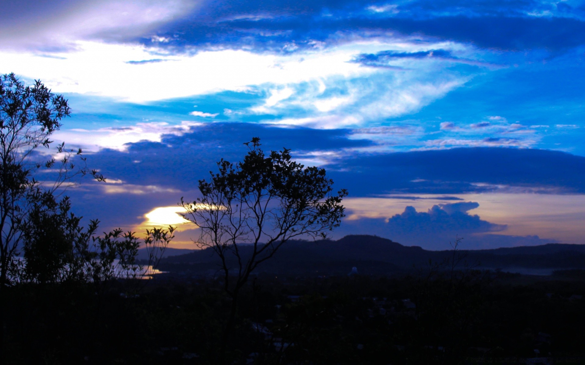 the sky sunset sky dusk evening dawn landscape nature tree outdoors travel sun mountain fair weather light scenic silhouette water