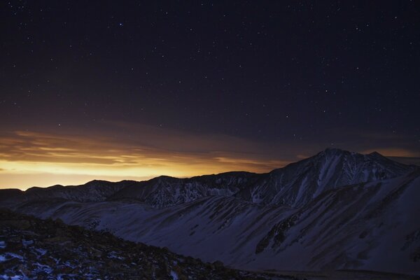 Mountain snowy landscape in the twilight