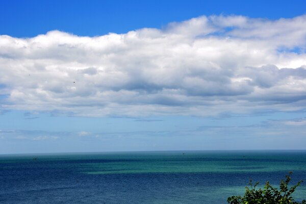 Blue sky snow-white clouds and blue sea