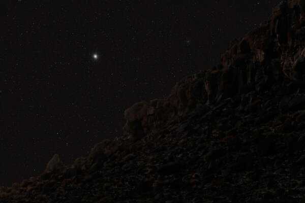 A bright star on the background of the Milky Way