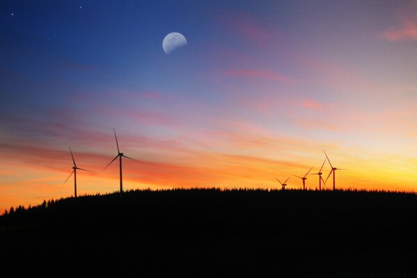 Puesta de sol romántica con molinos de viento