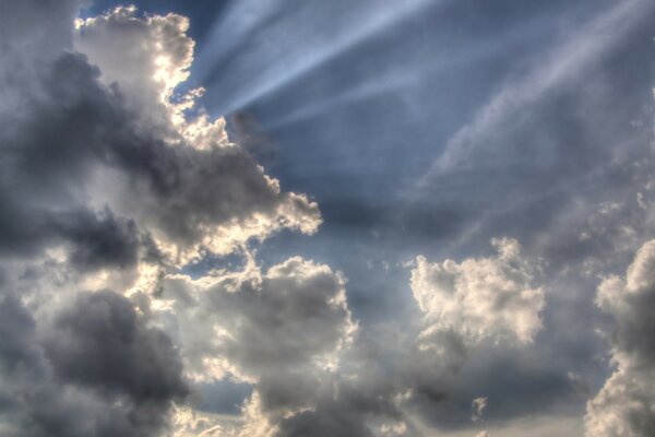 The sun is visible in the sky through the clouds