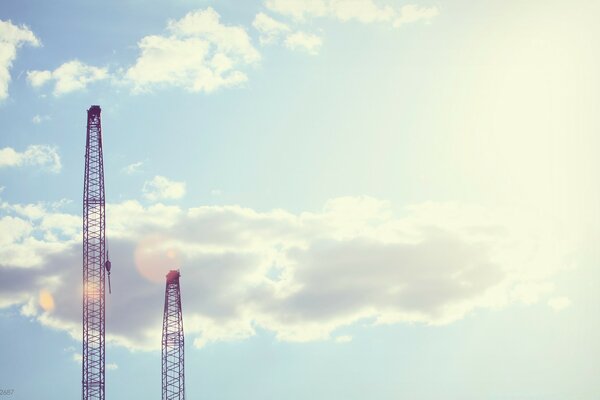 Sunny sky with clouds with building towers