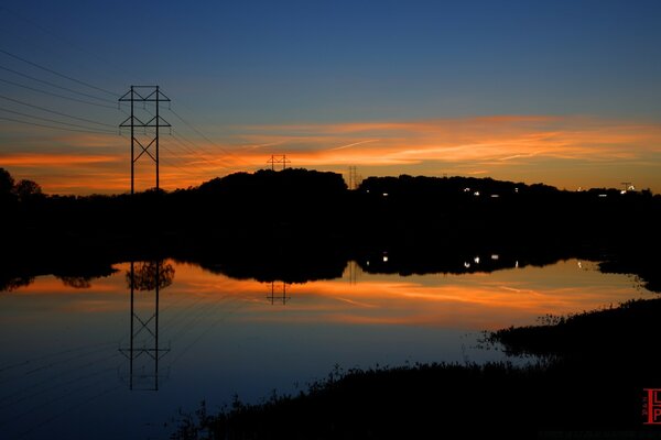 Beautiful pond on the background of sunset