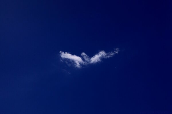 Strange clouds in the dark blue sky