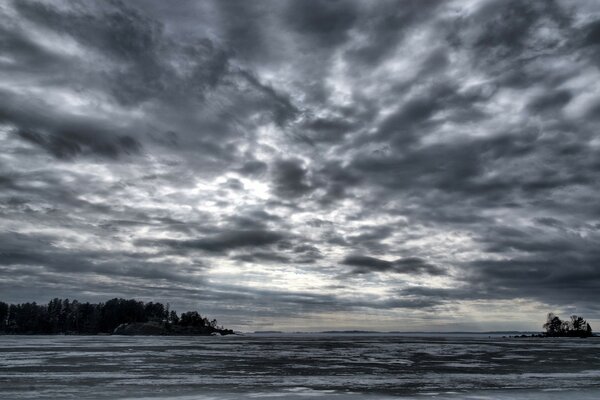 Gloomy stormy sky over the lake