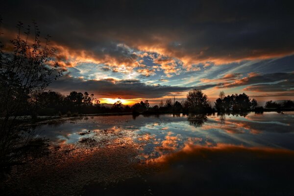 Sunset meeting by the lake at dusk