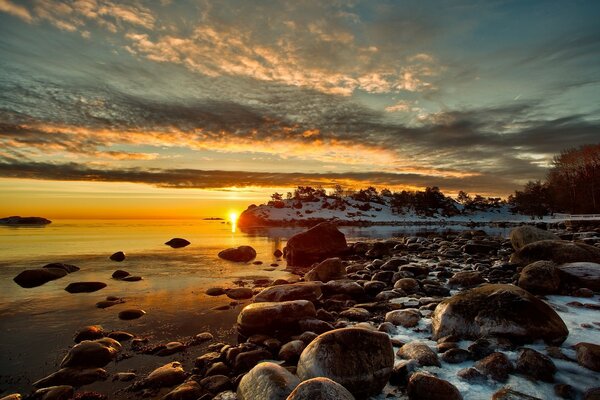 Winter lake on the background of sunset