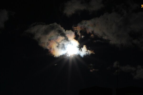 The sun in the clouds at night