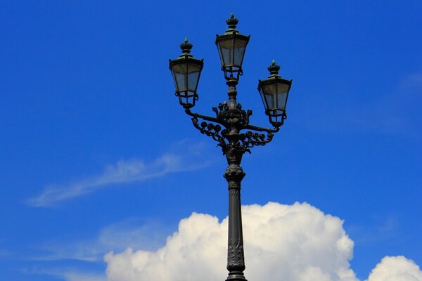 Lamppost on the background of clouds