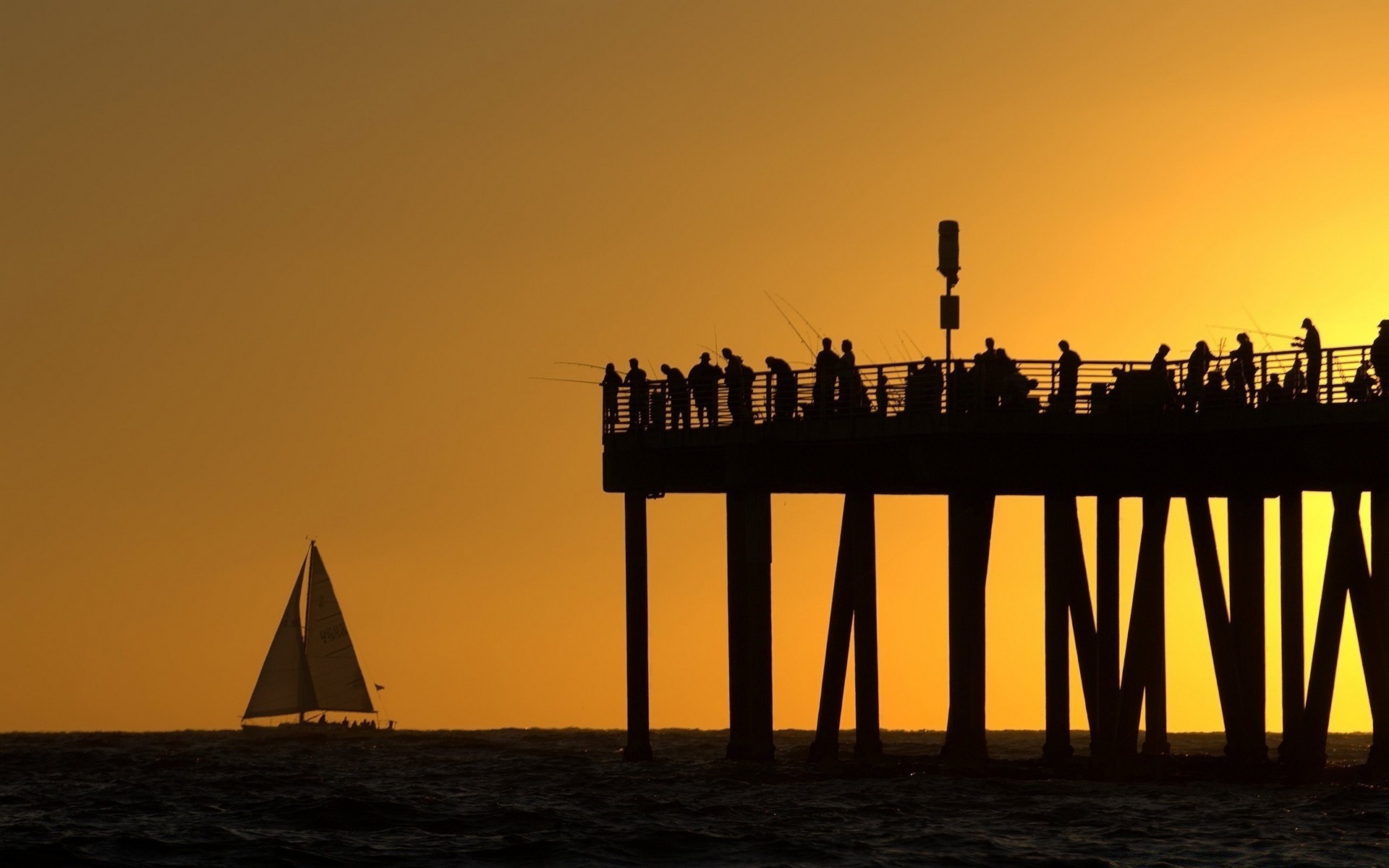 the sky sunset dawn water sea evening dusk beach silhouette ocean sun sky travel pier bridge light