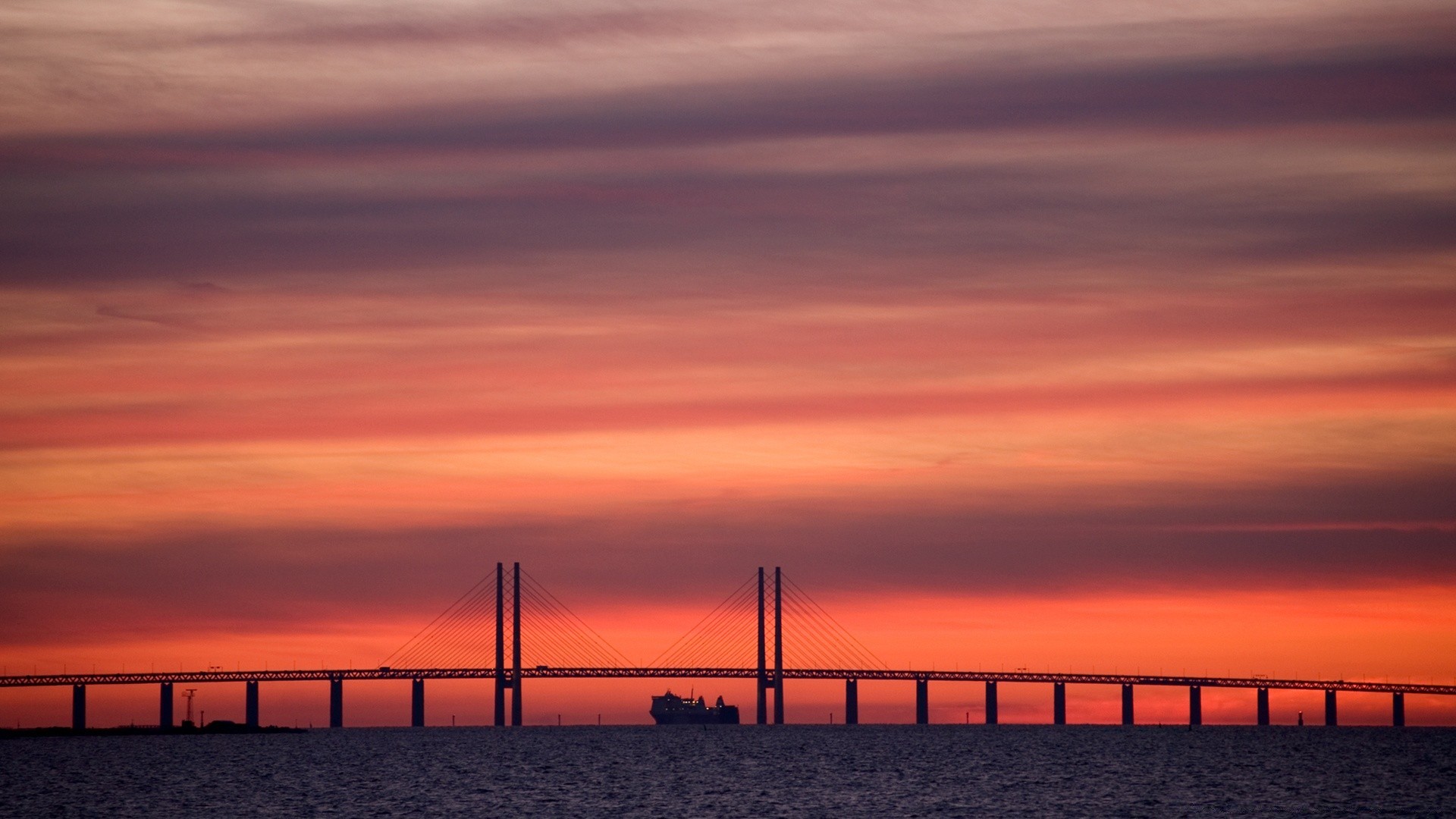 the sky sunset dawn sea water pier beach dusk ocean sun sky evening bridge light silhouette landscape