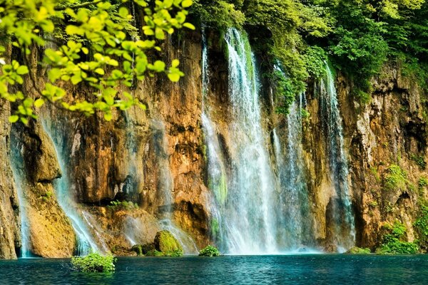 Beautiful cascade. Splashing waterfall