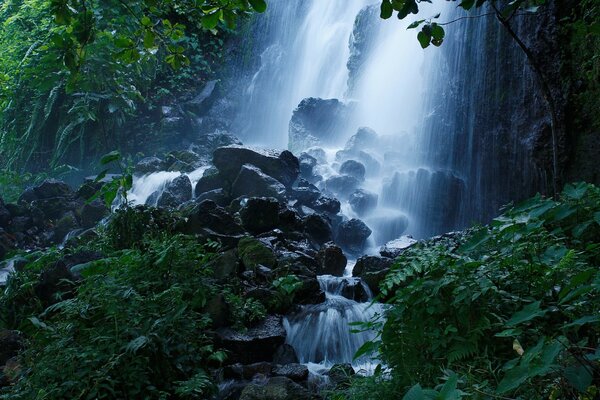 Mountain waterfall in the twilight of the night