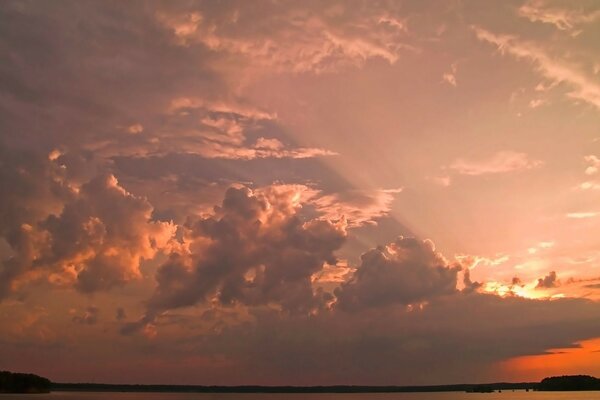 Clouds a little bit of sun on the whole picture over the lake