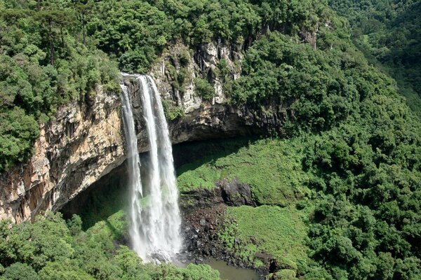 A huge waterfall among the green nature