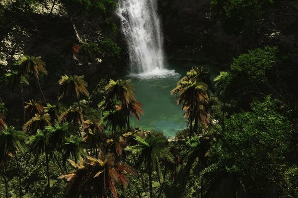 Waterfall in the tropics with blue water