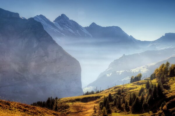 Great mountains stand above the plain, the landscape crashes with amazing force from the sky to the ground, beckons to travel