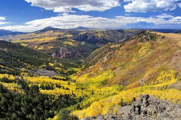 Landscape of wooded mountains against the sky